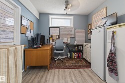 Room featuring wood-finish flooring, a neutral wall color, and a window for natural light - 
