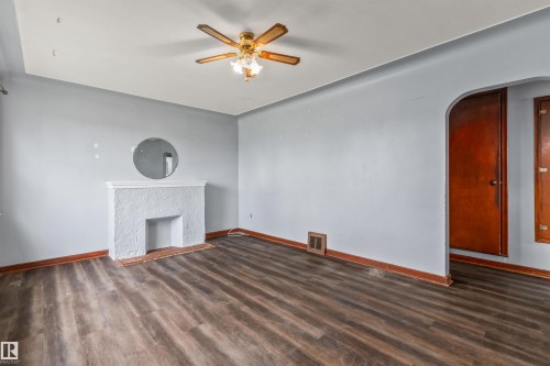 8331 81 Avenue, Edmonton, AB - Indoor Photo Showing Other Room With Fireplace
