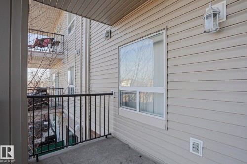 Private balcony featuring concrete flooring and black metal railings - 201 1520 Hammond Gate Gate, Edmonton, AB 