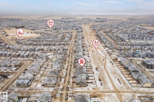 Aerial perspective showcasing a residential area with a prominent multi-use trail - 1668 Chapman Way Sw, Edmonton, AB - Outdoor With View