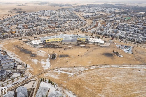 Aerial perspective showcasing a developed residential community with numerous single-family homes - 1668 Chapman Way Sw, Edmonton, AB - Outdoor With View