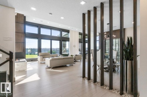 Front Entrance of the Home showing Grand Staircase and Main Living Area - 5536 Chegwin Point(E), Edmonton, AB - Indoor