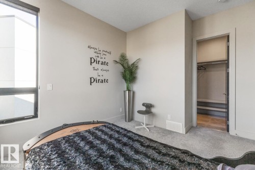 Upstairs Bedroom featuring Walk in Closet, Private Ensuite, and South West Facing Windows - 5536 Chegwin Point(E), Edmonton, AB - Indoor Photo Showing Bedroom
