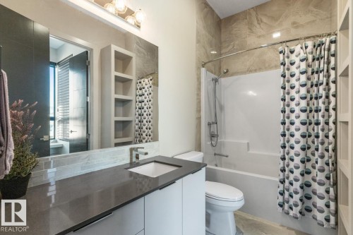 Upstairs Bathroom featuring Granite Counters and a Tub/Shower - 5536 Chegwin Point(E), Edmonton, AB - Indoor Photo Showing Bathroom