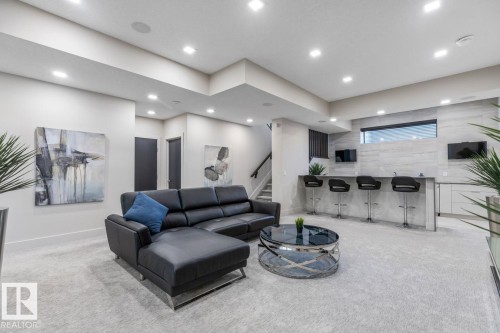 Perfect Space for Movie Nights! Unwind in your Basement Rec Room featuring a Full Wet Bar Space and Heated Floors - 5536 Chegwin Point(E), Edmonton, AB - Indoor