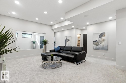 Perfect Space for Movie Nights! Unwind in your Basement Rec Room featuring a Full Wet Bar Space and Heated Floors - 5536 Chegwin Point(E), Edmonton, AB - Indoor
