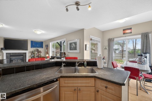 4333 Mcmullen Way Sw, Edmonton, AB - Indoor Photo Showing Kitchen With Fireplace With Double Sink