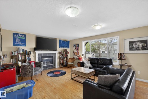 4333 Mcmullen Way Sw, Edmonton, AB - Indoor Photo Showing Living Room With Fireplace