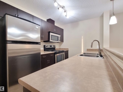432 1180 Hyndman Road, Edmonton, AB - Indoor Photo Showing Kitchen With Double Sink With Upgraded Kitchen