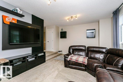 Neutral-toned walls complement the light-colored carpeting - 42 Santana Crescent, Fort Saskatchewan, AB - Indoor Photo Showing Living Room