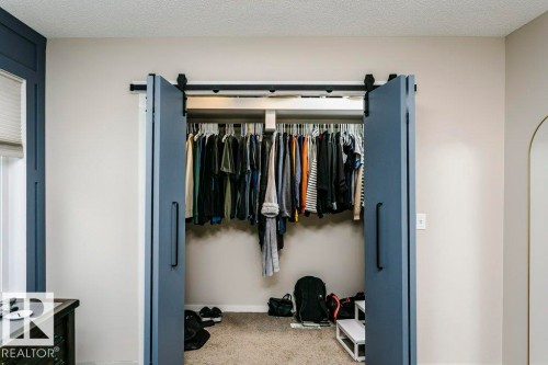 Modern barn doors with black hardware - 42 Santana Crescent, Fort Saskatchewan, AB - Indoor