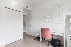 Light wood-finish flooring complements the neutral wall tones - 