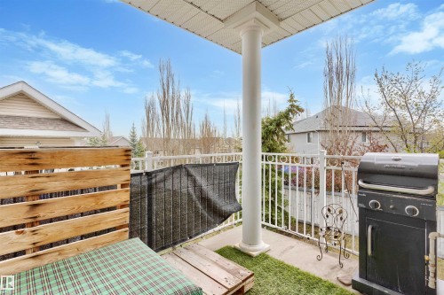 Covered outdoor balcony with a white railing and a privacy screen - 73 3040 Spence Wynd, Edmonton, AB - Outdoor With Exterior