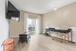 Light wood-finish flooring extending to a private balcony with artificial turf - 