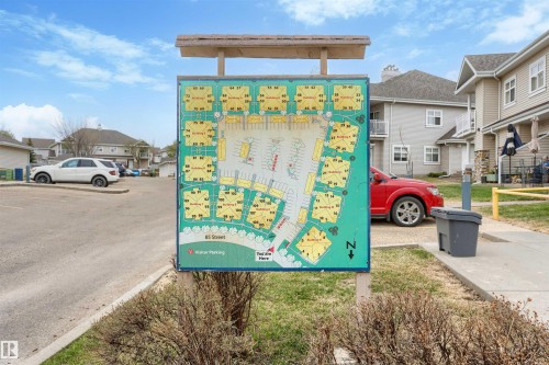 Community map display with a surrounding paved parking area - 73 3040 Spence Wynd, Edmonton, AB - Outdoor