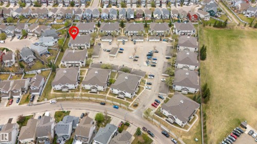 Aerial perspective showcasing a residential community with multiple multi-unit buildings - 73 3040 Spence Wynd, Edmonton, AB - Outdoor With View