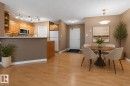 Open-concept living space featuring wood-finish flooring - 104 9760 174 Street, Edmonton, AB  - Indoor Photo Showing Dining Room 