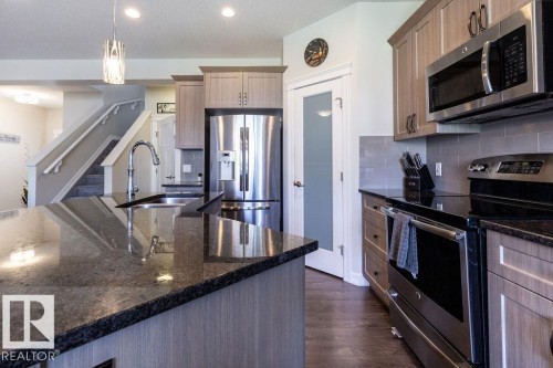 14207 138 Street Nw, Edmonton, AB - Indoor Photo Showing Kitchen With Stainless Steel Kitchen With Double Sink With Upgraded Kitchen