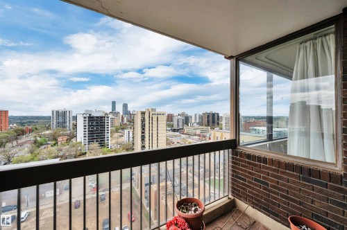 Balcony featuring a metal railing and a partial brick wall - 1603 10025 113 Street, Edmonton, AB - Outdoor With Balcony With View With Exterior