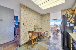 Slate-look tile flooring in a multi-toned pattern defines this interior space - 