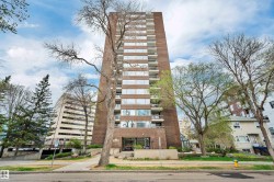 Brick facade high-rise building featuring multiple levels of balconies - 