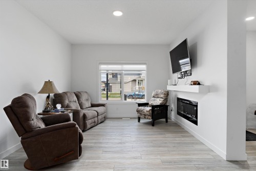 623 Black, Leduc, AB - Indoor Photo Showing Living Room With Fireplace