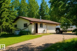 Cream-colored siding exterior with a brown roof and matching trim - 