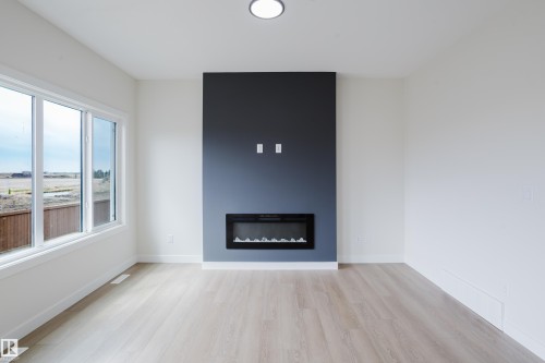 6223 29 Avenue, Edmonton, AB - Indoor Photo Showing Living Room With Fireplace