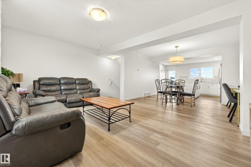 Open-concept living space featuring light wood-finish flooring throughout - 38 Jensen Gate, St. Albert, AB - Indoor Photo Showing Living Room
