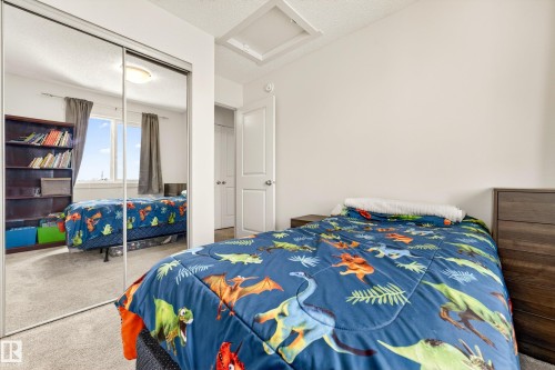 Bedroom featuring carpeted flooring and white painted walls - 38 Jensen Gate, St. Albert, AB - Indoor Photo Showing Bedroom