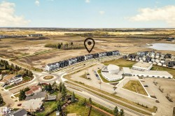 Aerial perspective showcasing a developing residential area with a series of modern townhomes - 