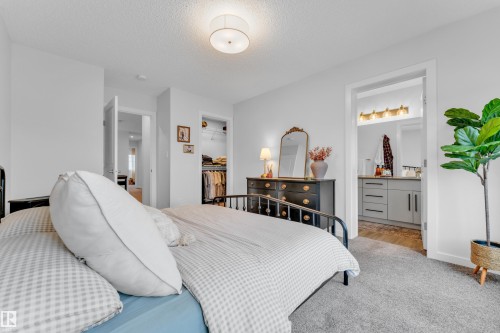 Spacious room featuring light-colored walls and grey carpeting - 17319 2 St Nw, Edmonton, AB - Indoor Photo Showing Bedroom