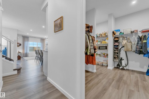 Spacious walk-in pantry with wire shelving and ample storage - 17319 2 St Nw, Edmonton, AB - Indoor Photo Showing Other Room