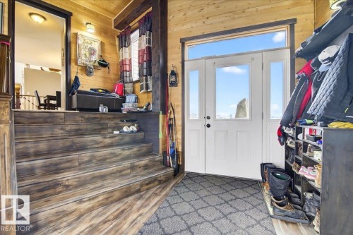 This space features wood-style flooring and bright white trim - 531064 Range Road 174, Rural Lamont County, AB - Indoor Photo Showing Other Room