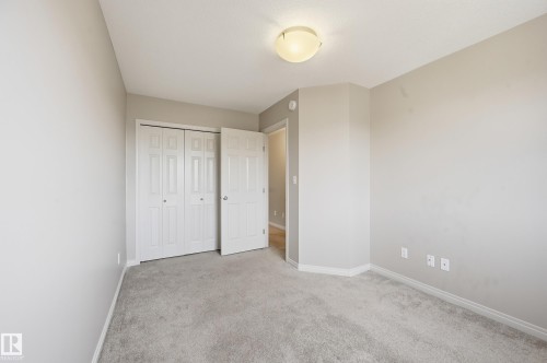 Neutral tone wall paint with light gray carpet flooring - 2170 52A Street Sw, Edmonton, AB - Indoor Photo Showing Other Room