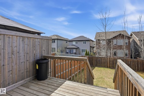 Spacious wood-plank deck featuring a wooden privacy fence and gazebo structure - 2170 52A Street Sw, Edmonton, AB - Outdoor With Deck Patio Veranda With Exterior