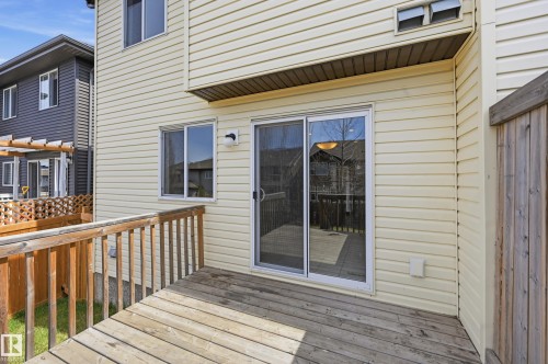 Rear deck featuring wooden railing and horizontal siding - 2170 52A Street Sw, Edmonton, AB - Outdoor With Deck Patio Veranda With Exterior