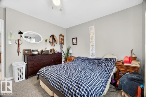 Interior room featuring light gray walls and neutral carpet - 4212 105 Avenue, Edmonton, AB - Indoor Photo Showing Bedroom