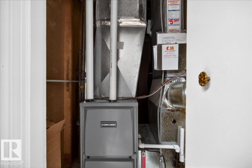 Concord furnace installation featuring white PVC piping and galvanized ductwork - 4212 105 Avenue, Edmonton, AB - Indoor Photo Showing Other Room