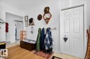 Entryway featuring wood-finish flooring, white paneled bifold closet doors, and recessed lighting - 4212 105 Avenue, Edmonton, AB  - Indoor Photo Showing Other Room 
