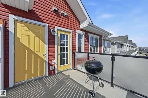 Private balcony featuring a concrete surface and a glass-paneled railing - 34 2905 141 Street, Edmonton, AB - Outdoor With Exterior