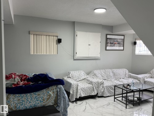 Spacious room featuring light gray walls and polished tile flooring - 3139 34B Avenue, Edmonton, AB 