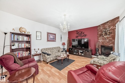 8811 38A Avenue, Edmonton, AB - Indoor Photo Showing Living Room With Fireplace