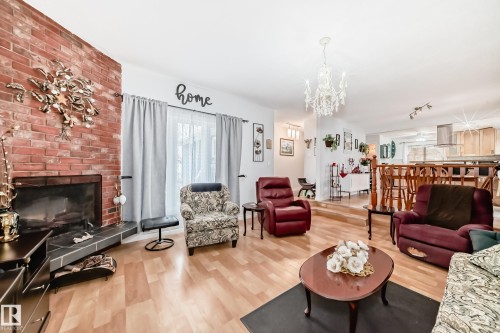 8811 38A Avenue, Edmonton, AB - Indoor Photo Showing Living Room With Fireplace