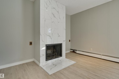113 10838 108 Street, Edmonton, AB - Indoor With Fireplace