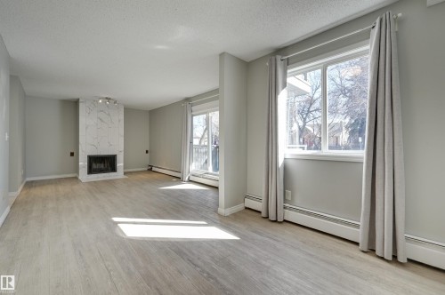113 10838 108 Street, Edmonton, AB - Indoor With Fireplace
