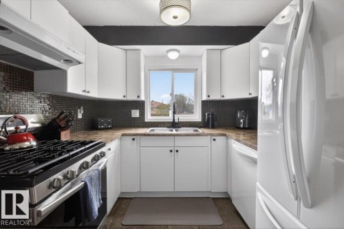 8409 99 Avenue, Fort Saskatchewan, AB - Indoor Photo Showing Kitchen With Double Sink