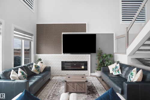 4709 Charles Bay, Edmonton, AB - Indoor Photo Showing Living Room With Fireplace