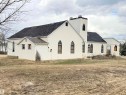 Stucco exterior with a dark shingle roof - 5036 49 Street, Clyde, AB  - Outdoor 