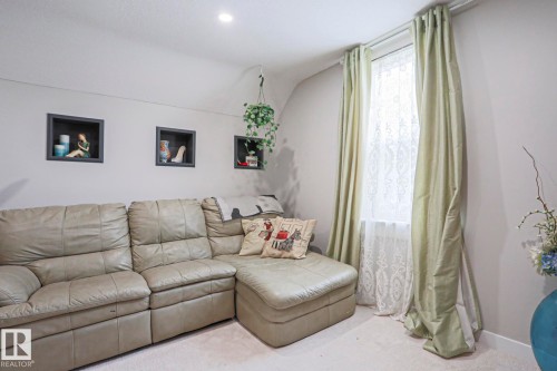 Recessed lighting illuminates a space featuring three wall-mounted display niches - 5113 53 Avenue, Stony Plain, AB - Indoor Photo Showing Living Room